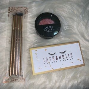 Bundle of brushes, blush, and eye lashes